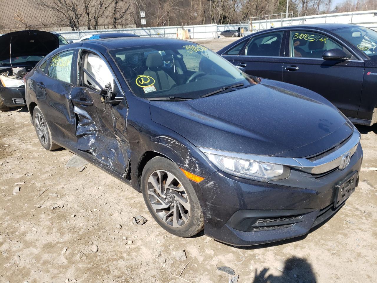 HONDA CIVIC EX 2018 with VIN 2HGFC2F77JH525475 - Photo from auction