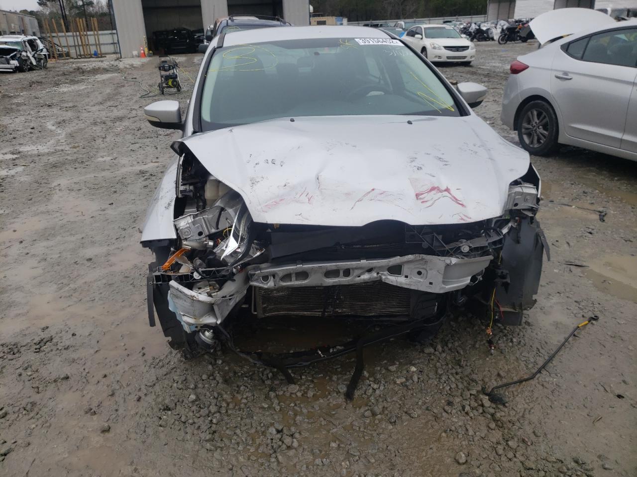 Foto 9 de la subasta – 2014 FORD FOCUS SE con VIN 1FADP3F23EL121270
