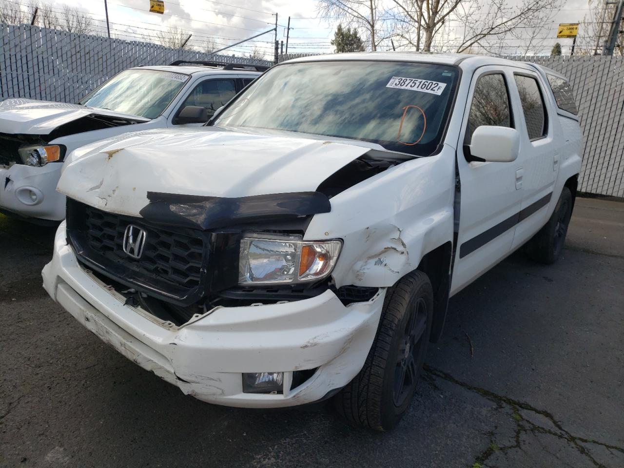 Photo 2 from auction – 2013 HONDA RIDGELINE with VIN 5FPYK1F54DB019011
