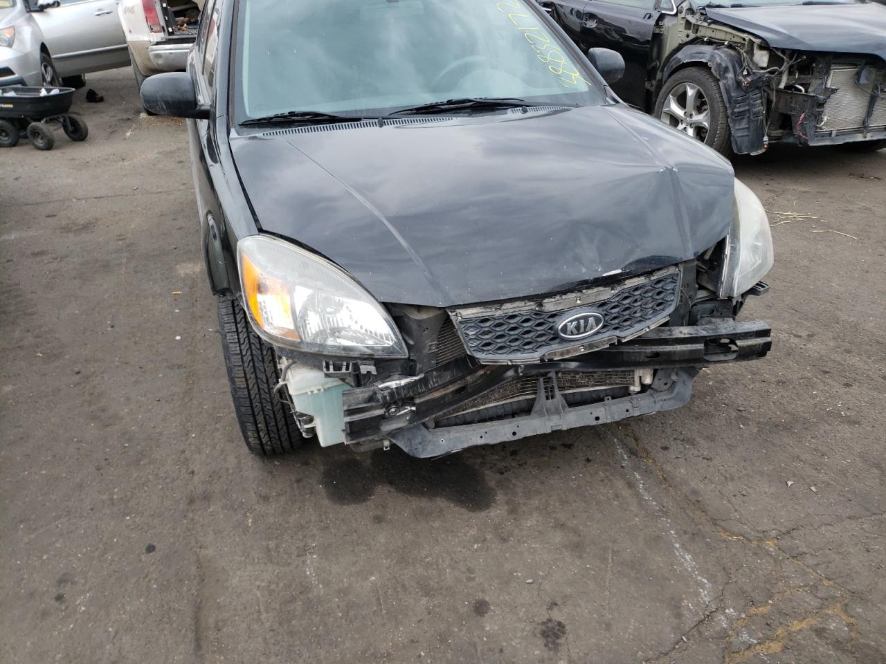 Photo 9 from auction – 2011 KIA RIO BASE with VIN KNADH4A35B6959854