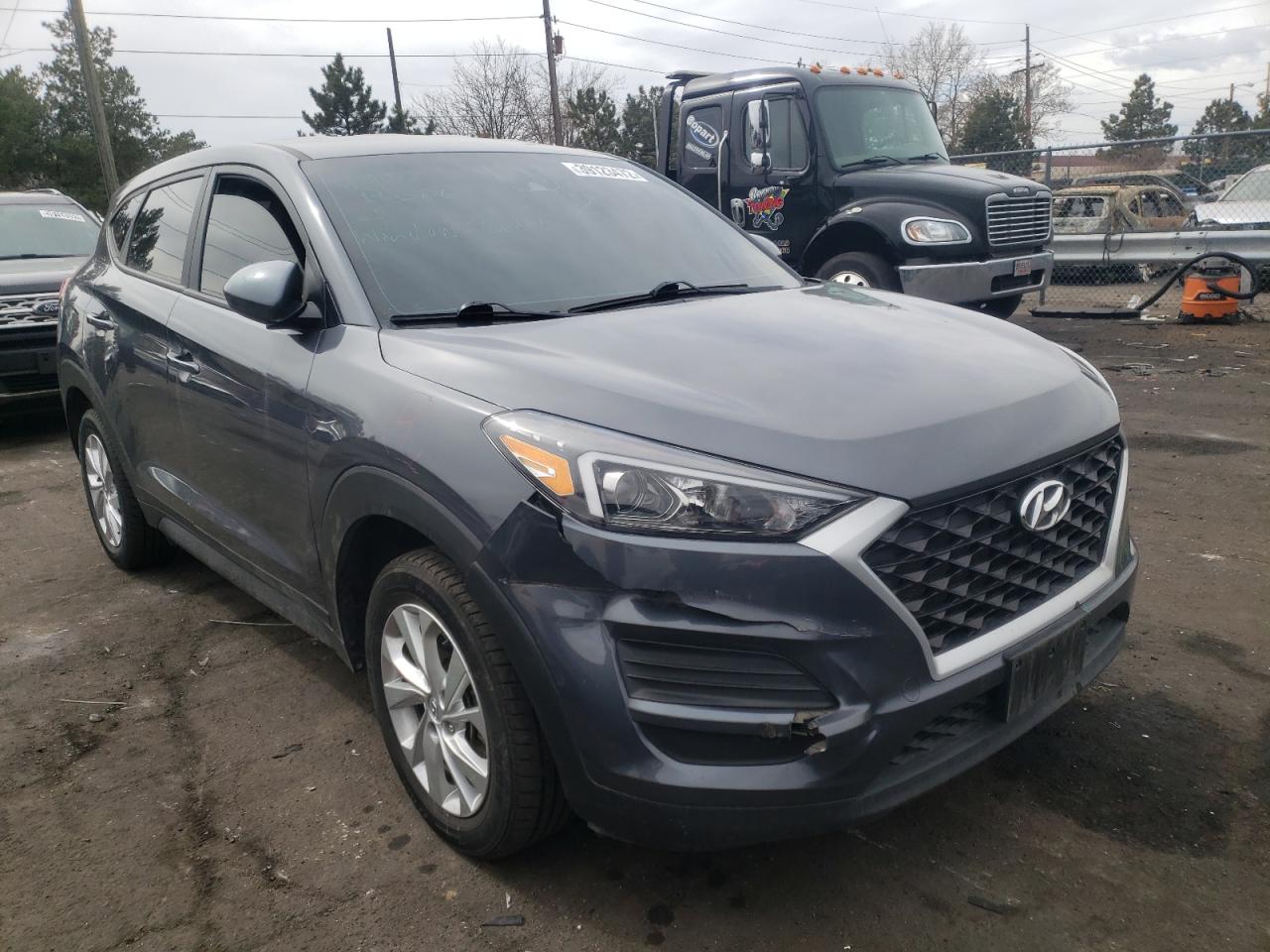 HYUNDAI TUCSON SE 2019 with VIN KM8J2CA41KU002882 - Photo from auction