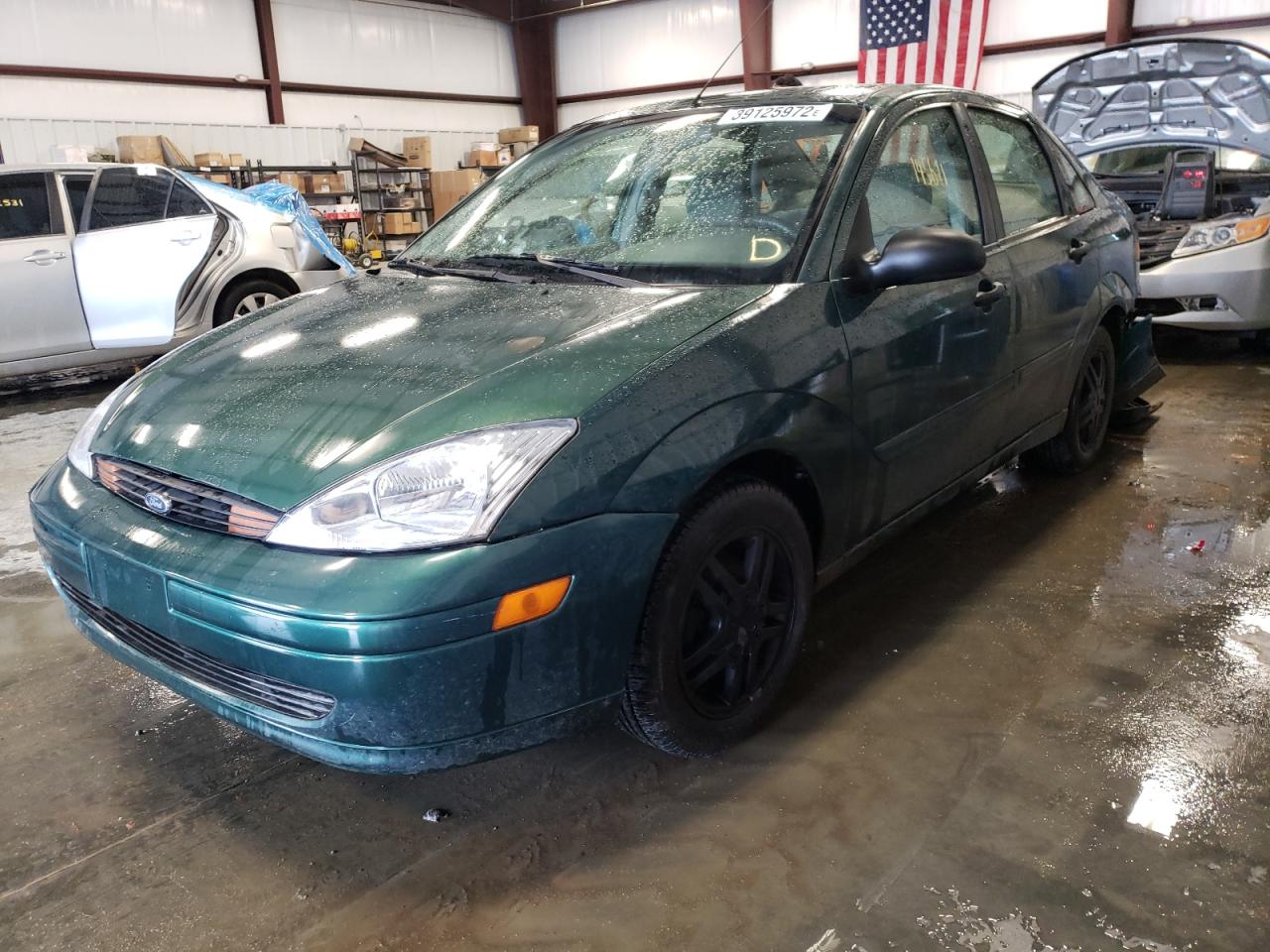 Photo 2 from auction – 2000 FORD FOCUS with VIN 1FAFP343XYW386226