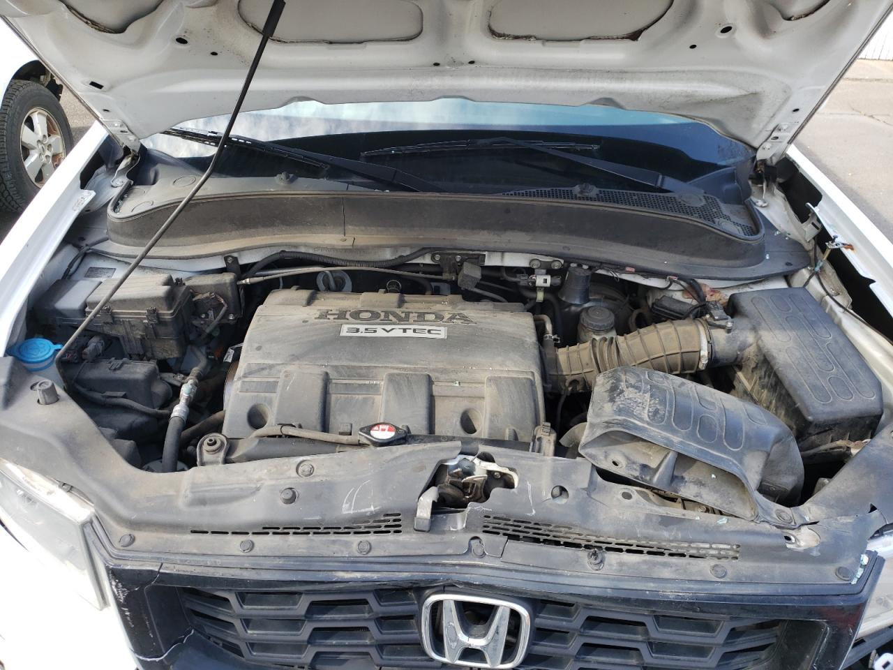 Photo 7 from auction – 2013 HONDA RIDGELINE with VIN 5FPYK1F54DB019011