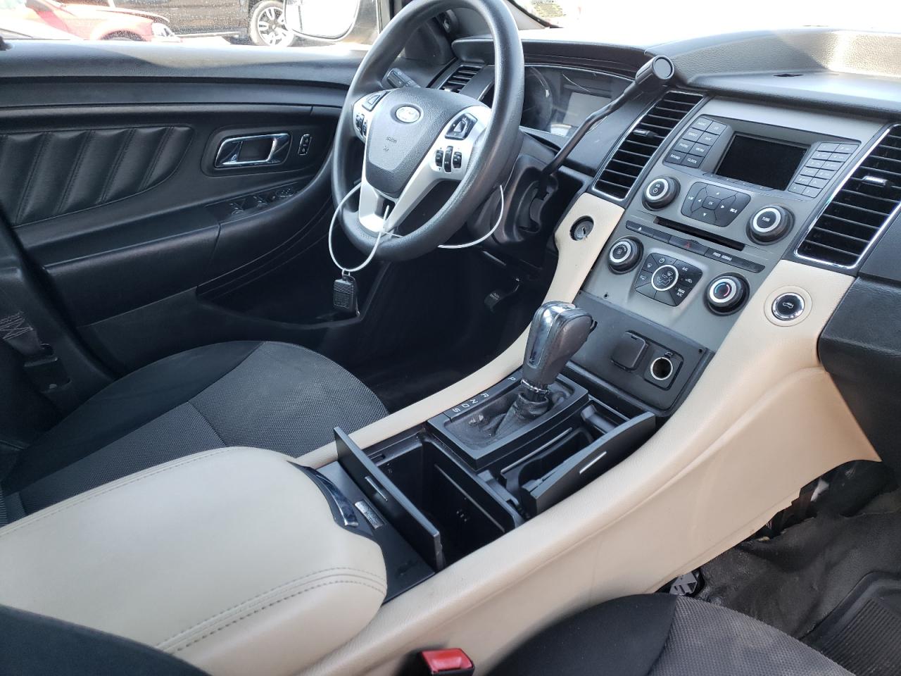 Photo 9 from auction – 2014 FORD TAURUS POL with VIN 1FAHP2MKXEG105672