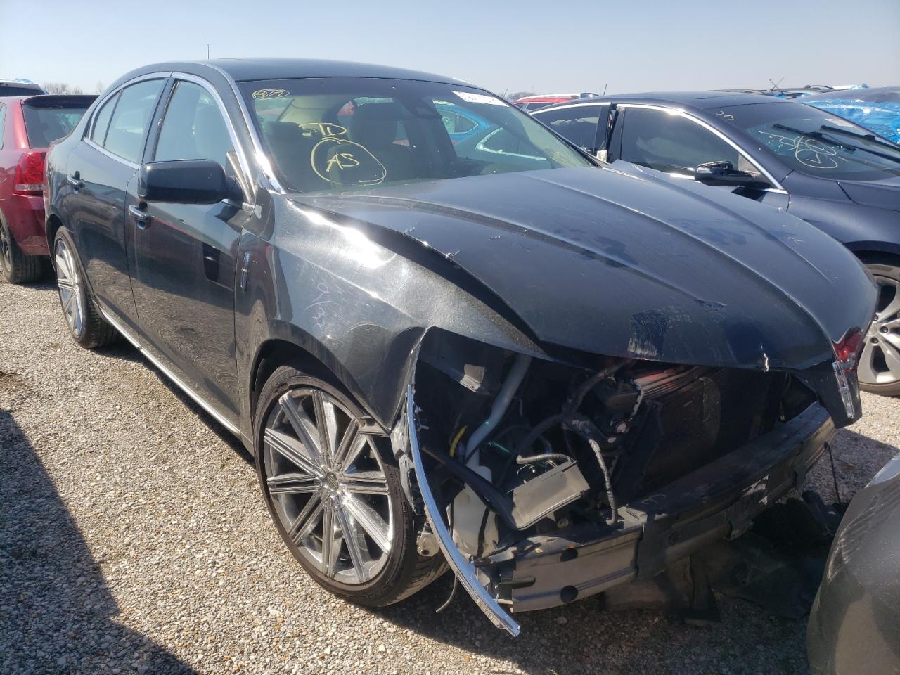 LINCOLN MKS 2015 with VIN 1LNHL9DK8FG604661 - Photo from auction