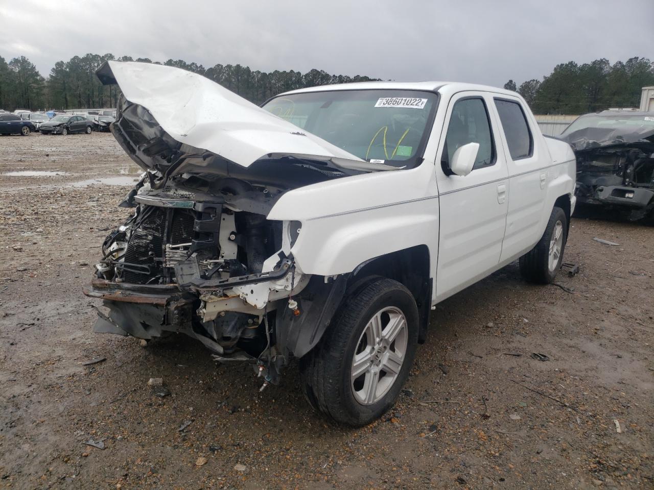Photo 2 from auction – 2013 HONDA RIDGELINE with VIN 5FPYK1F58DB018010