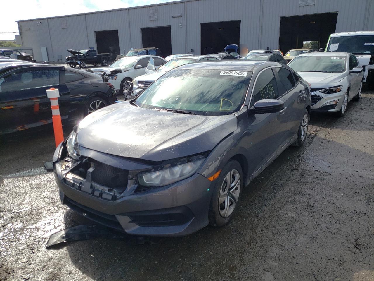 Photo 2 from auction – 2016 HONDA CIVIC LX with VIN 19XFC2F54GE031320