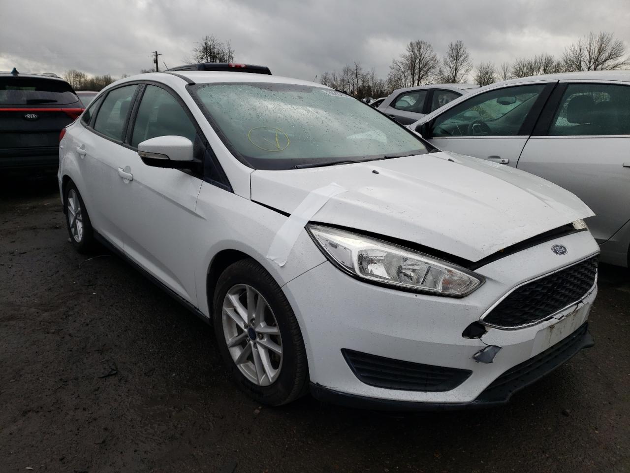 FORD FOCUS SE 2016 with VIN 1FADP3F26GL298690 - Photo from auction