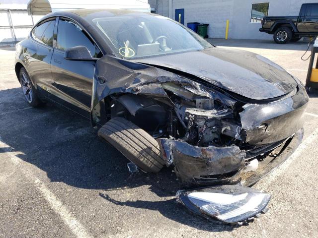 TESLA MODEL 3 2022 with VIN 5YJ3E1EB0NF128665 - Photo from auction