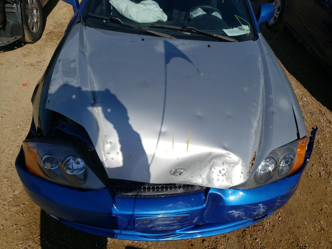 Photo 7 from auction – 2004 HYUNDAI TIBURON with VIN KMHHM65D94U152097