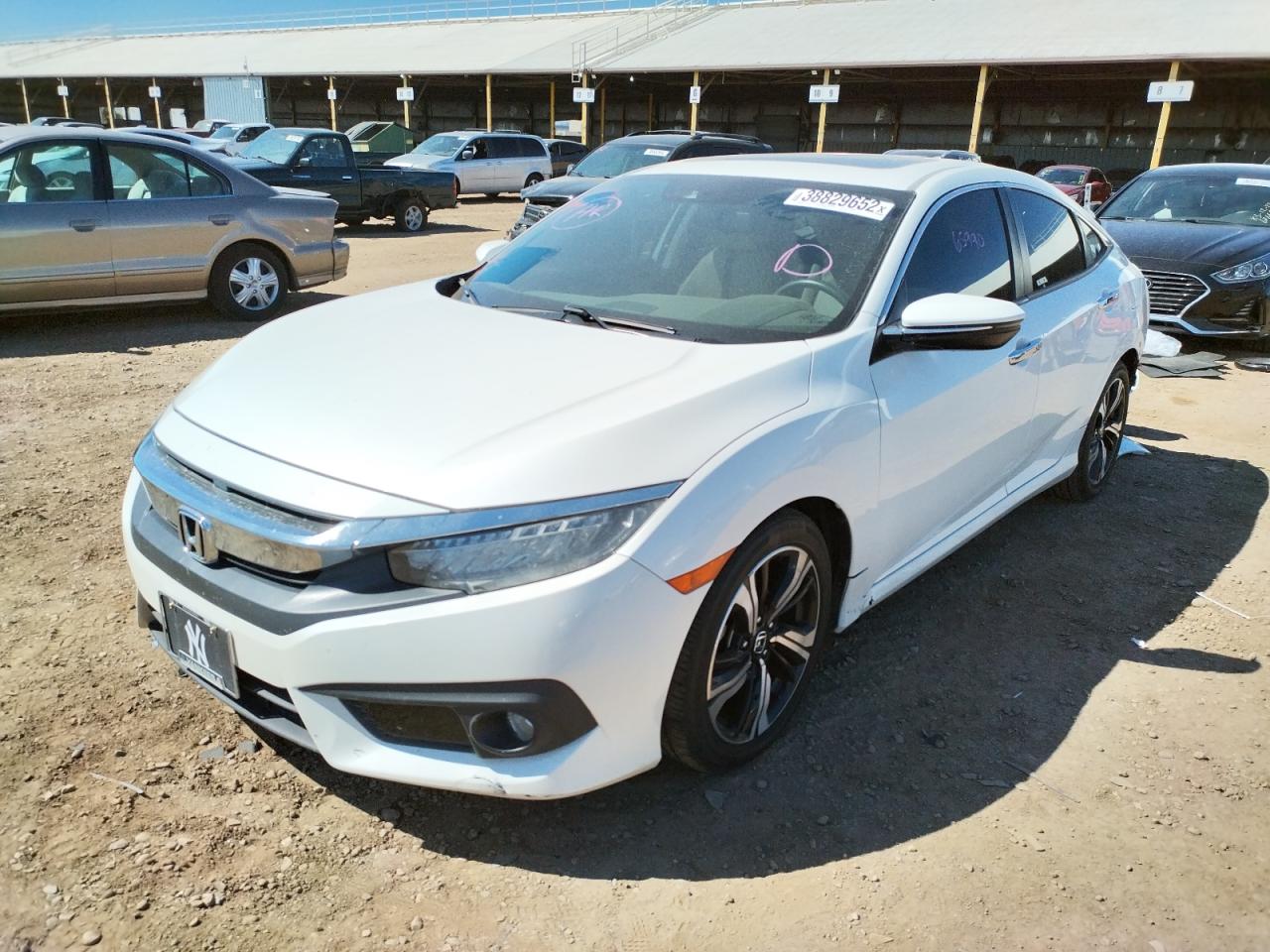 Photo 2 from auction – 2016 HONDA CIVIC TOUR with VIN 19XFC1F94GE201110