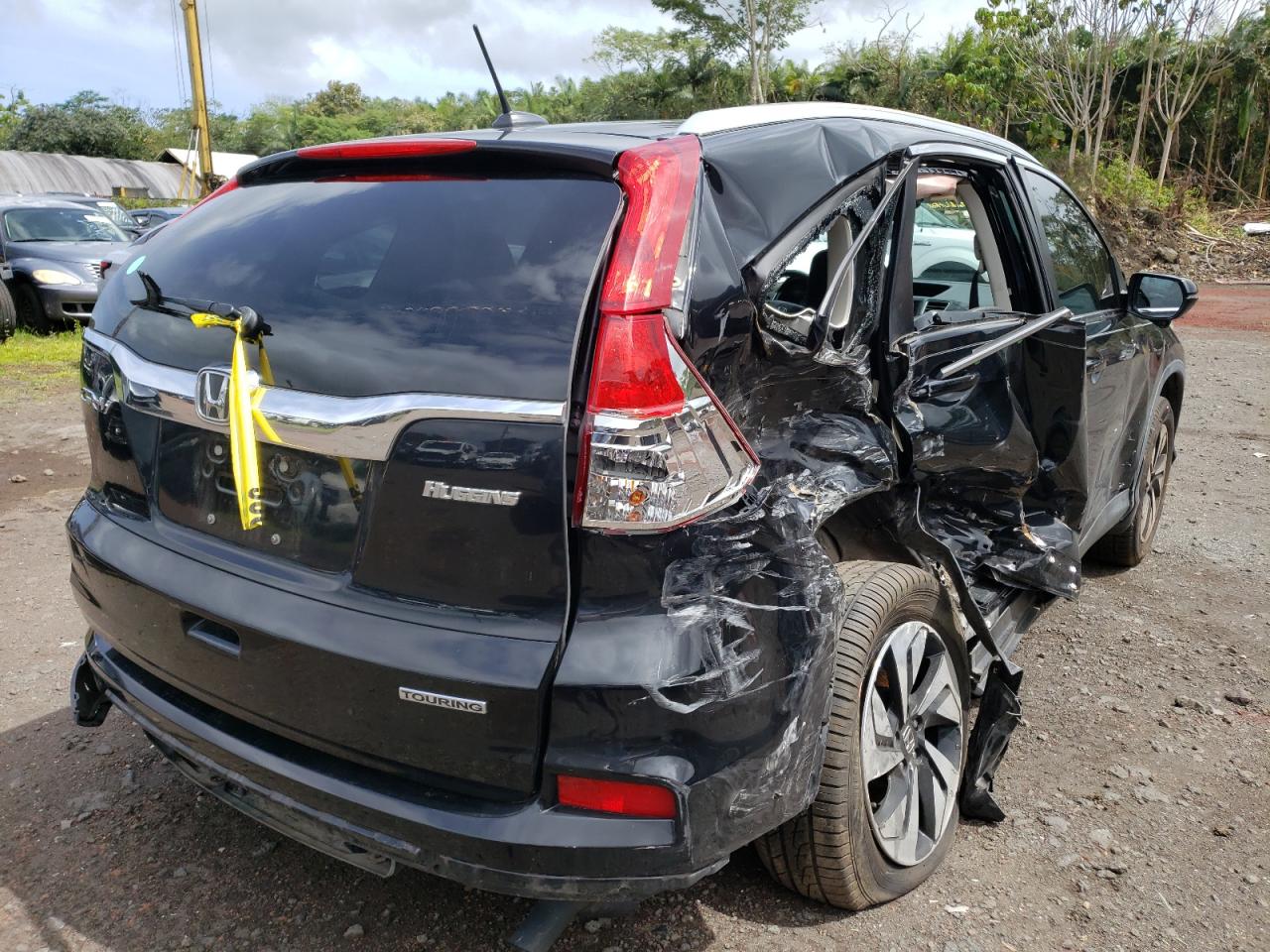 Photo 4 from auction – 2015 HONDA CR-V TOURI with VIN 5J6RM3H99FL021429