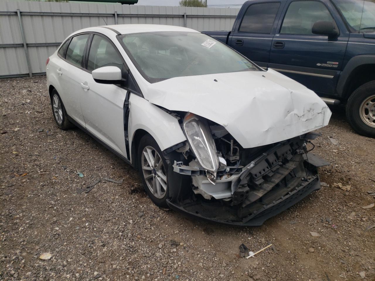 FORD FOCUS SE 2018 with VIN 1FADP3F20JL289023 - Photo from auction