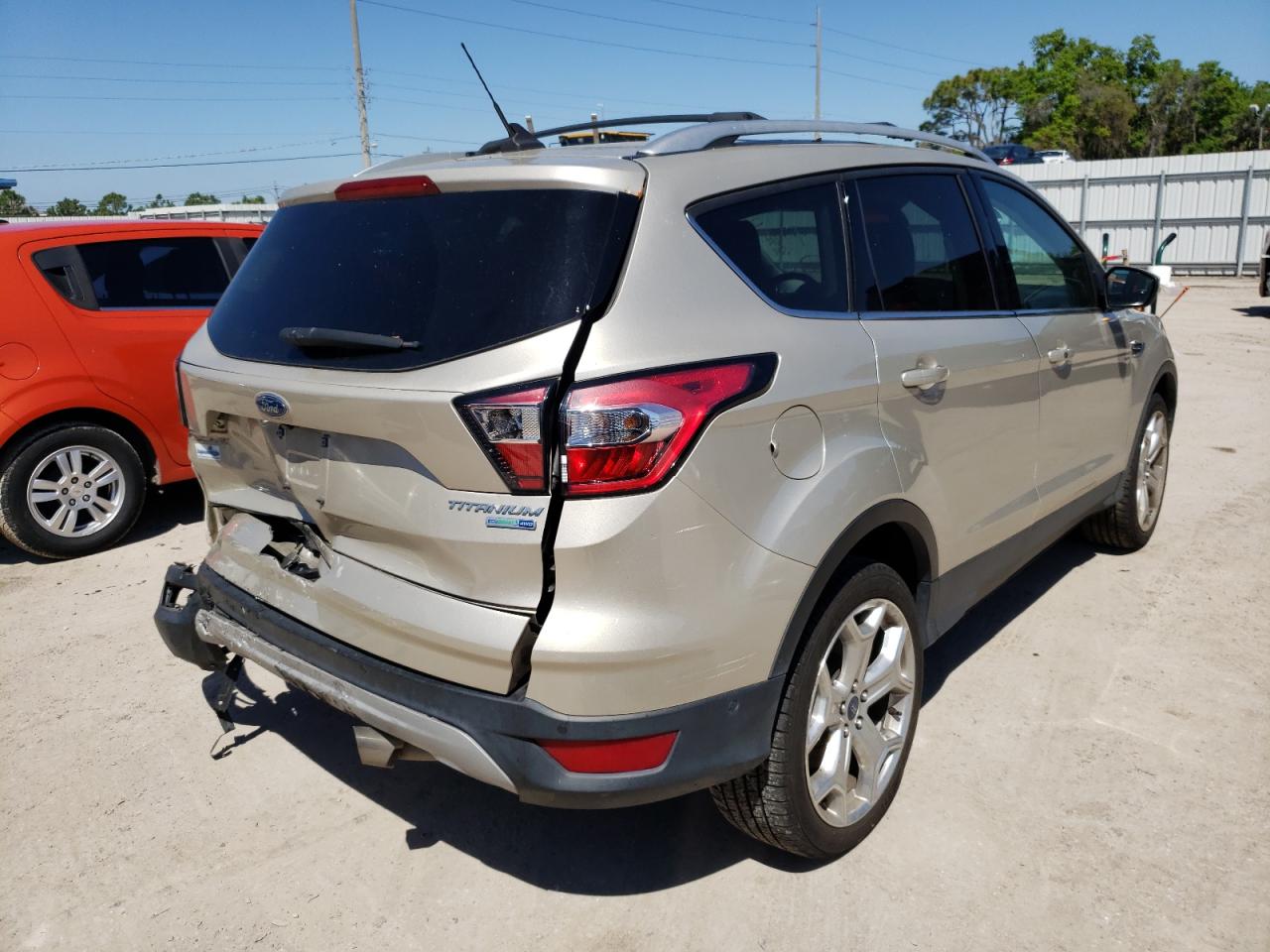 Photo 4 from auction – 2018 FORD ESCAPE TIT with VIN 1FMCU9J94JUD12332