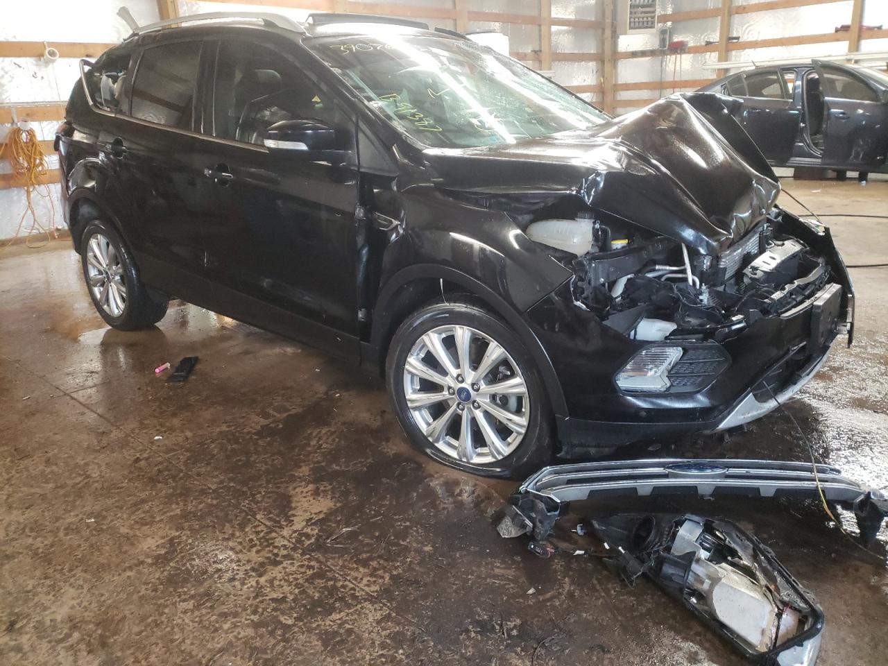 FORD ESCAPE TIT 2017 with VIN 1FMCU0J96HUB91387 - Photo from auction