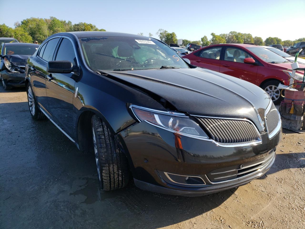 LINCOLN MKS 2015 with VIN 1LNHL9DK4FG607833 - Photo from auction
