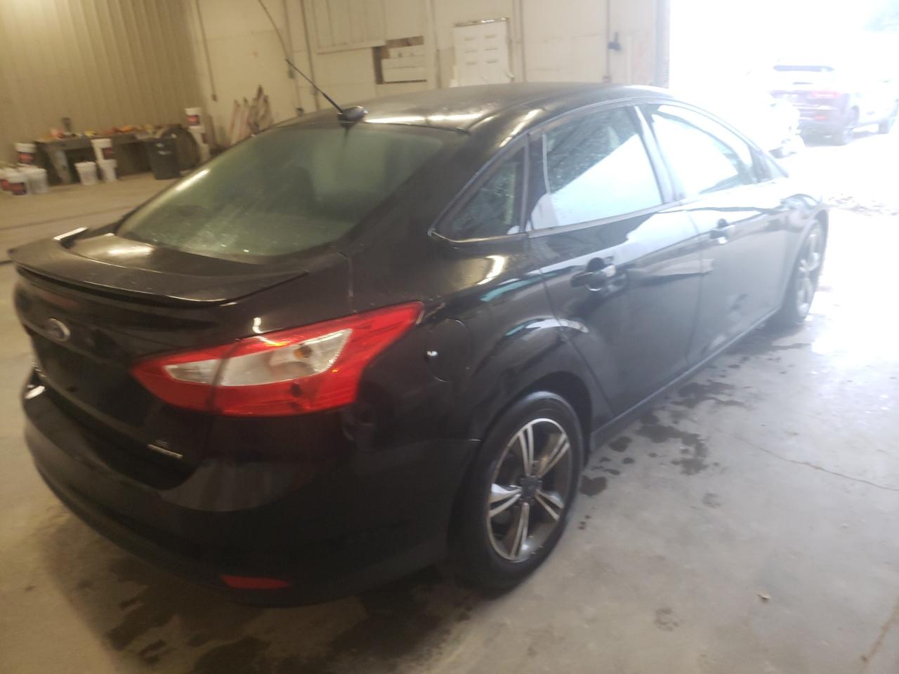 Foto 4 de la subasta – 2014 FORD FOCUS SE con VIN 1FADP3F21EL309253