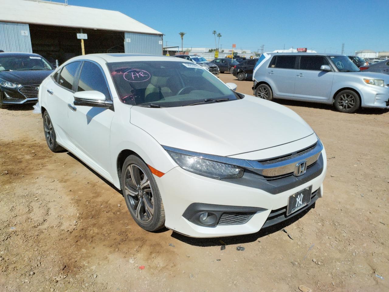 HONDA CIVIC TOUR 2016 with VIN 19XFC1F94GE201110 - Photo from auction