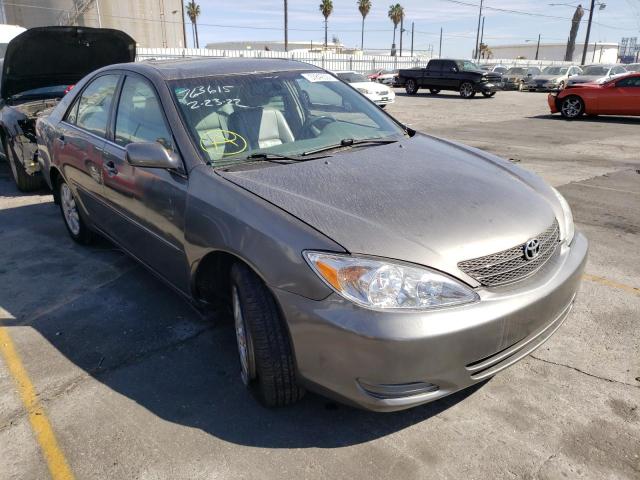 TOYOTA CAMRY LE 2004 with VIN 4T1BF32K44U586557 - Photo from auction