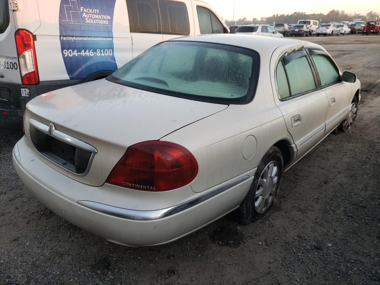 Photo 4 from auction – 2002 LINCOLN CONTINENTA with VIN 1LNHM97V42Y700035