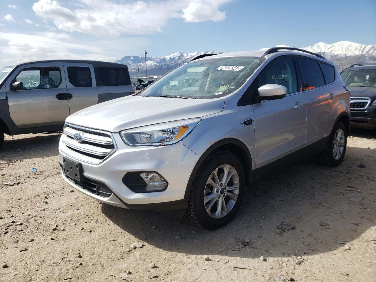 Photo 2 from auction – 2018 FORD ESCAPE SE with VIN 1FMCU9GD9JUB17581