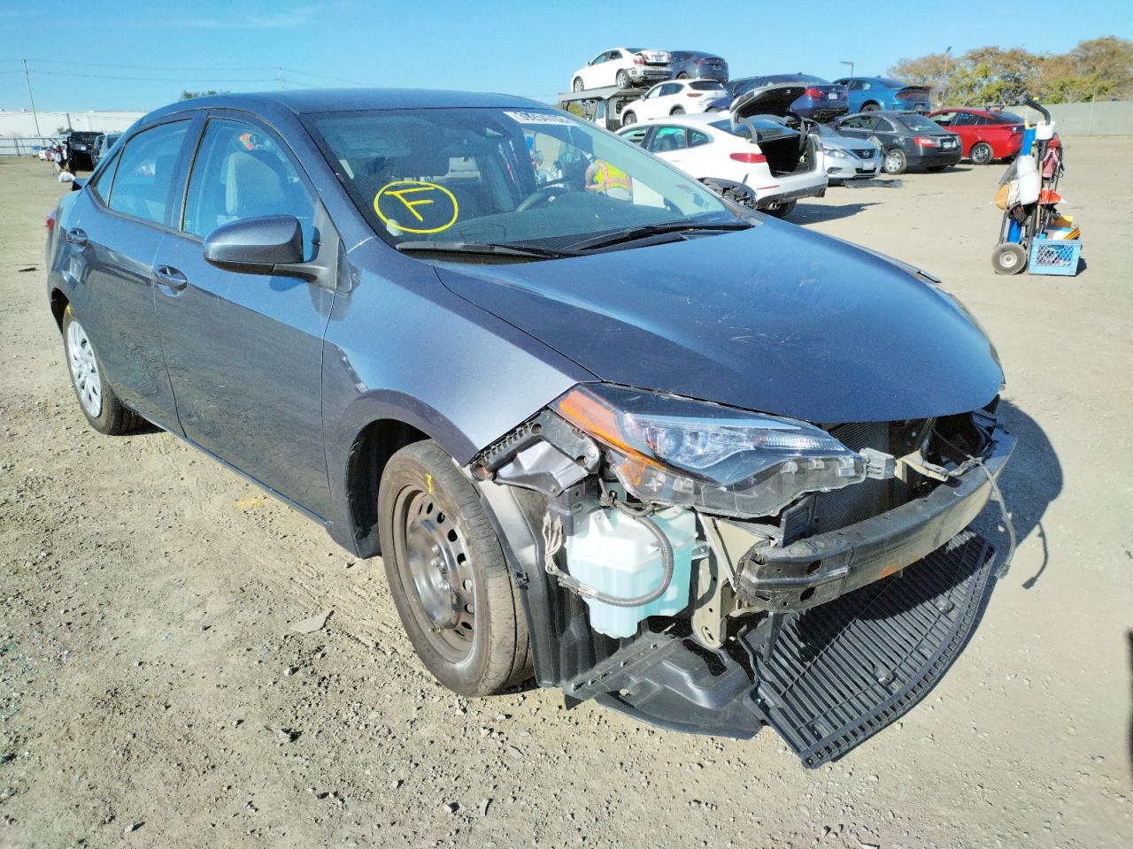 TOYOTA COROLLA L 2017 with VIN 5YFBURHE0HP694563 - Photo from auction