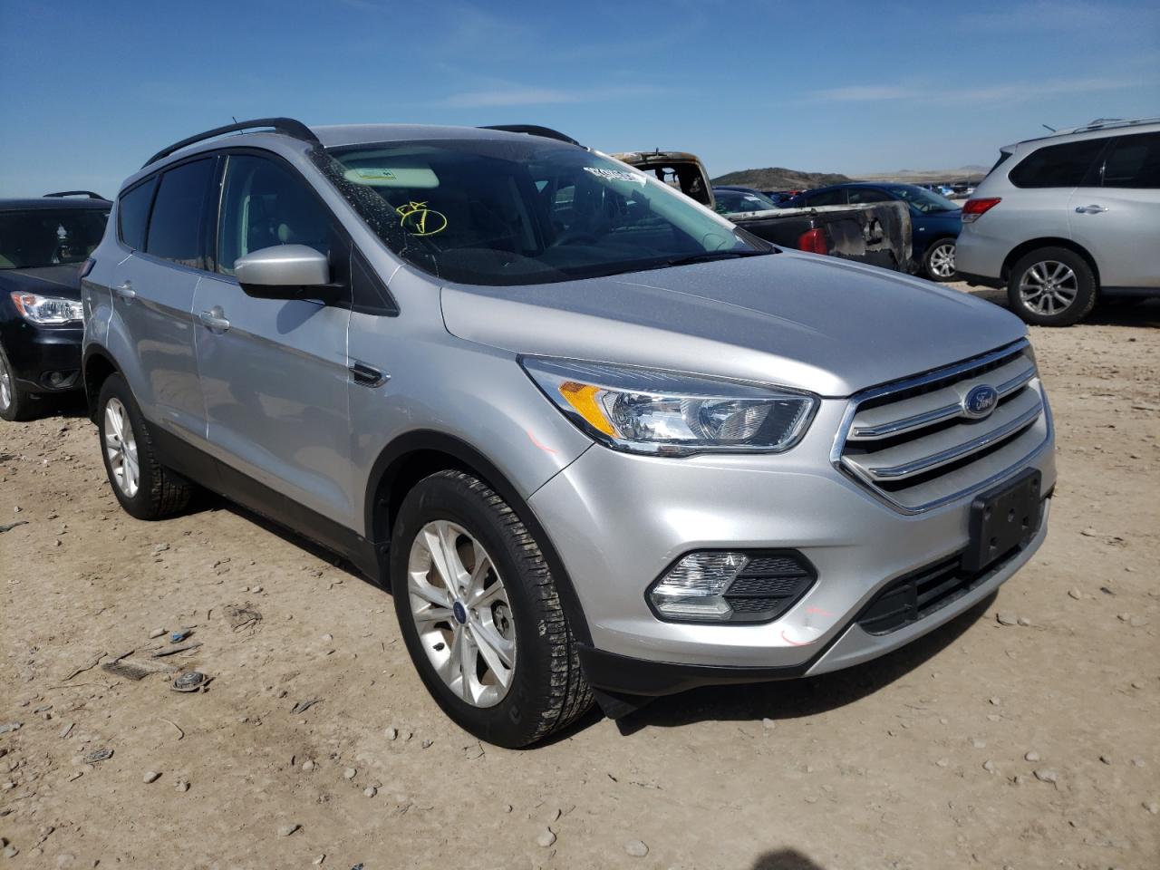 FORD ESCAPE SE 2018 with VIN 1FMCU9GD9JUB17581 - Photo from auction