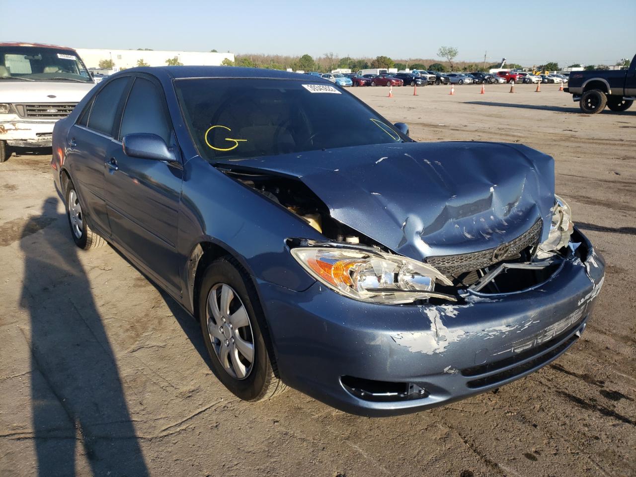 TOYOTA CAMRY LE 2003 with VIN JTDBE32KX30239652 - Photo from auction