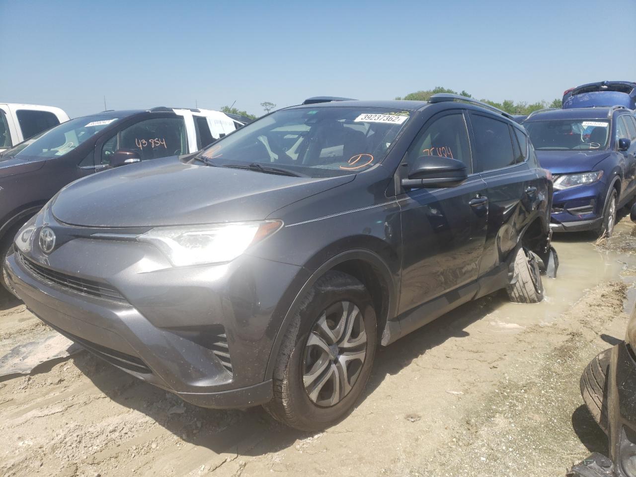 Photo 2 from auction – 2017 TOYOTA RAV4 LE with VIN JTMZFREV2HJ138031