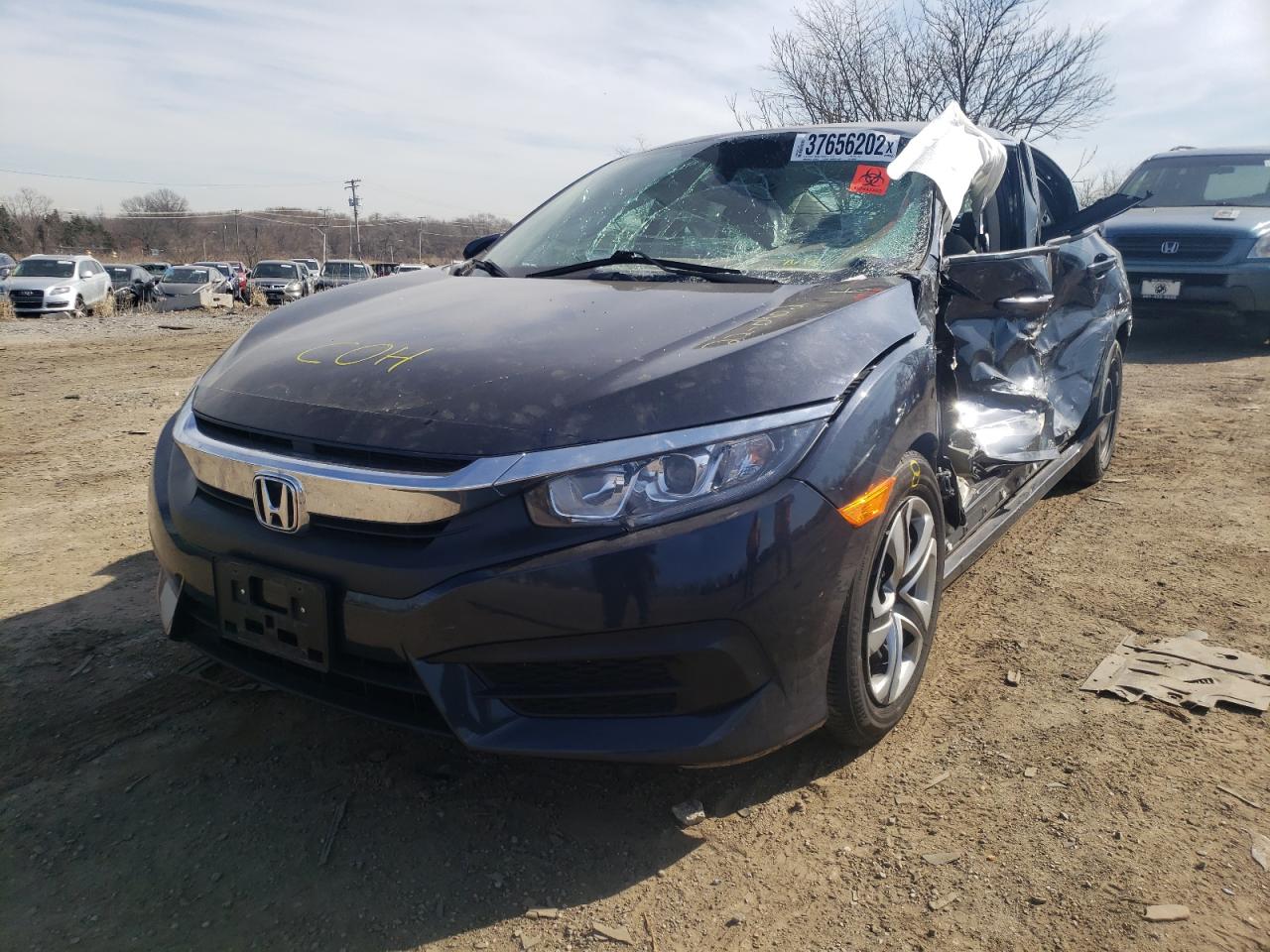 Photo 2 from auction – 2018 HONDA CIVIC LX with VIN 2HGFC2F58JH606502