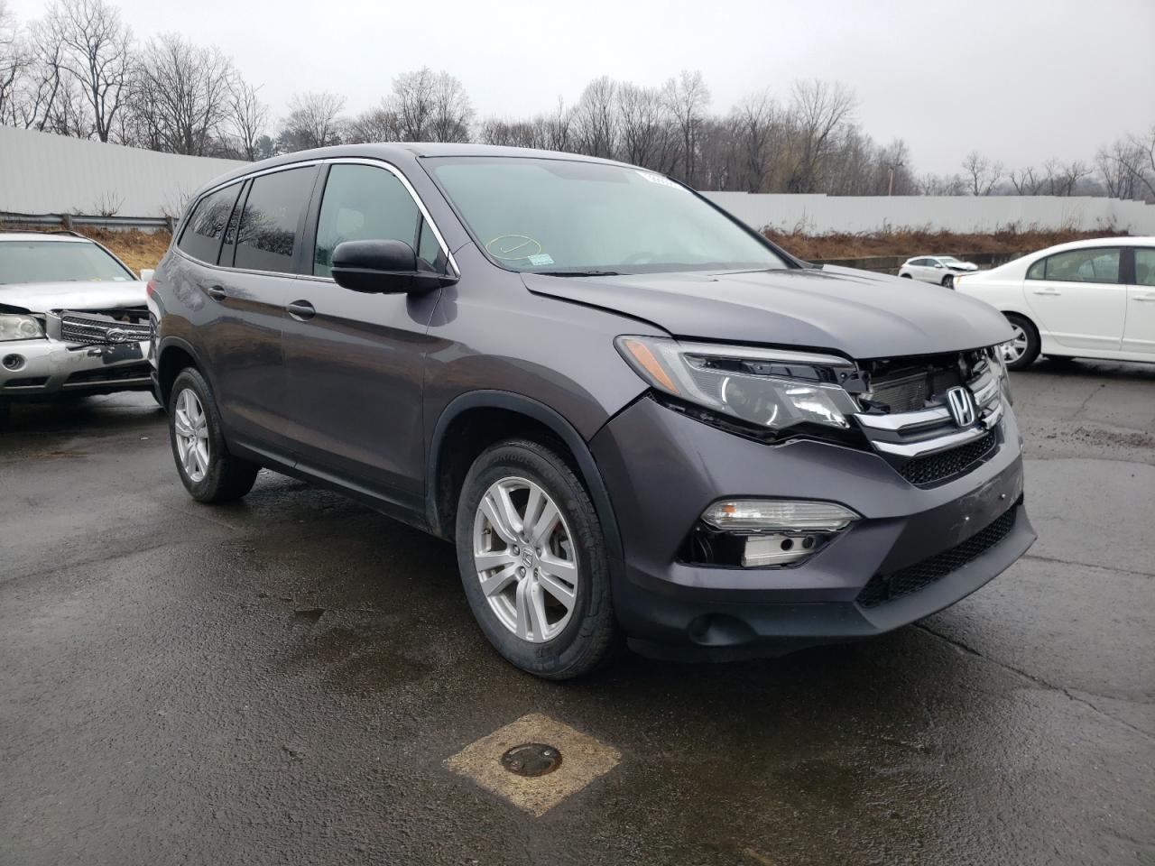 HONDA PILOT LX 2018 with VIN 5FNYF6H16JB062703 - Photo from auction