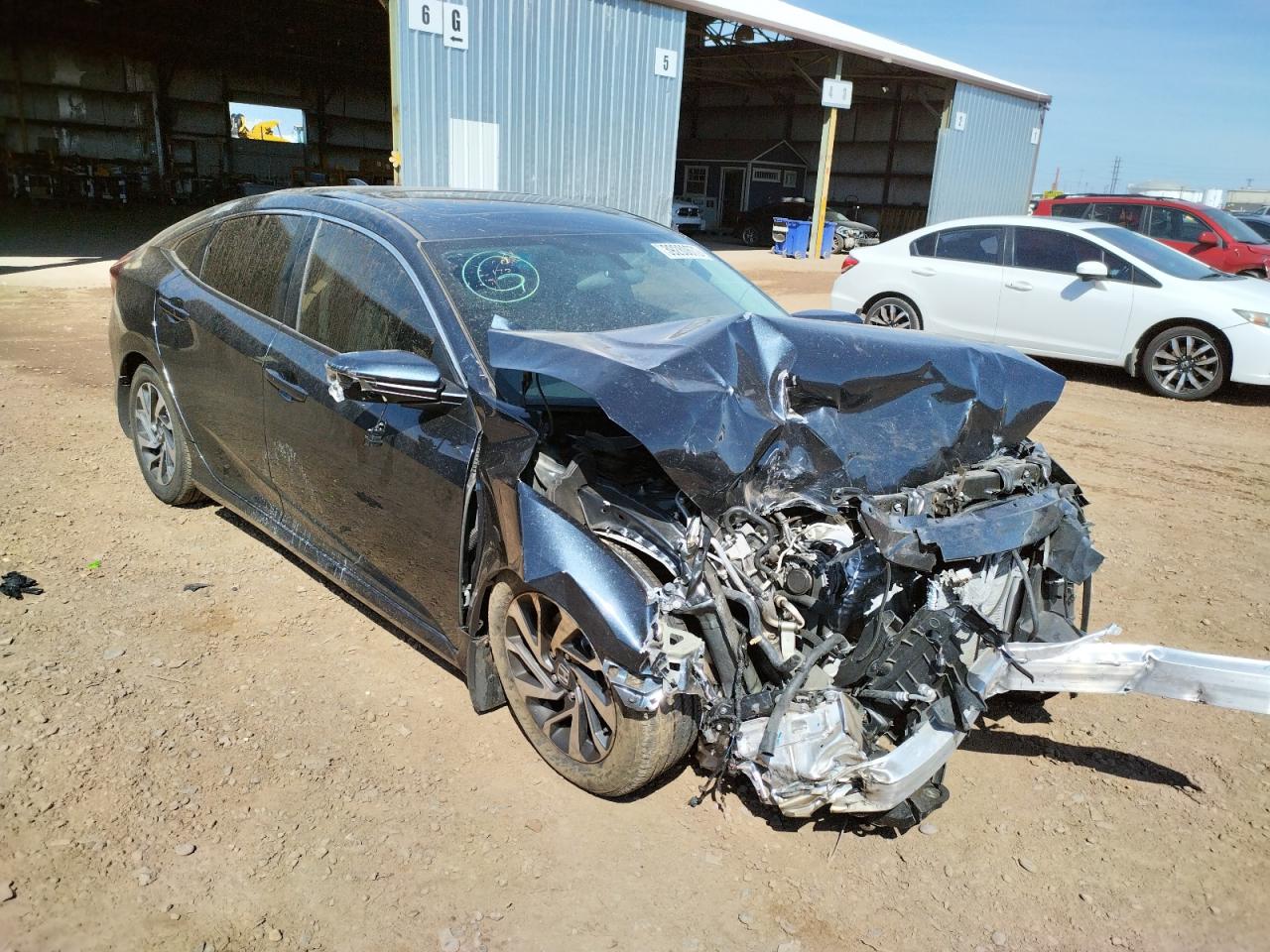 HONDA CIVIC EX 2018 with VIN 19XFC2F7XJE010447 - Photo from auction