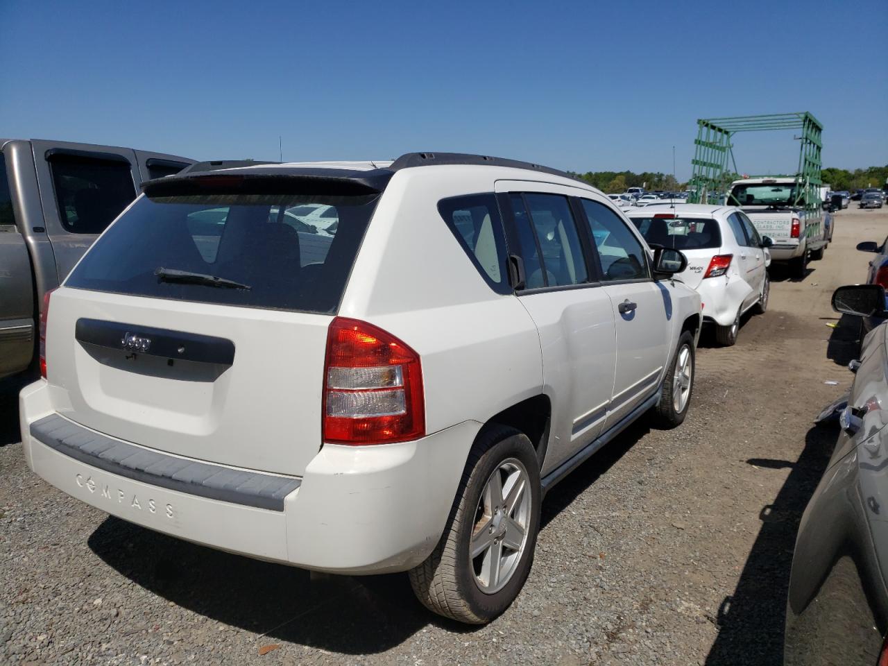 Photo 4 from auction – 2010 JEEP COMPASS SP with VIN 1J4NT4FB8AD553979