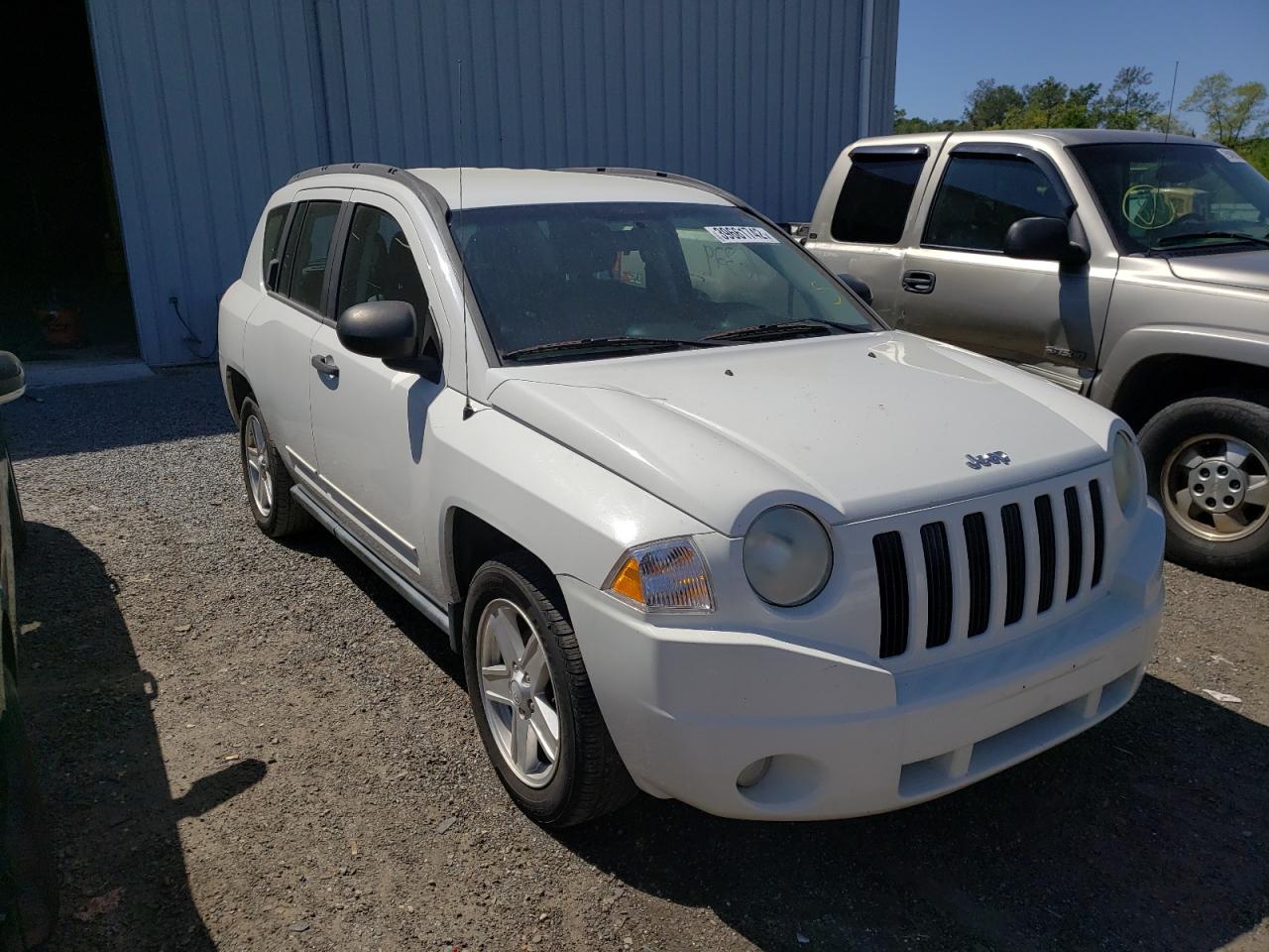 JEEP COMPASS SP 2010 with VIN 1J4NT4FB8AD553979 - Photo from auction
