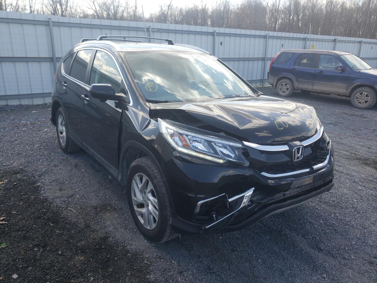 HONDA CR-V EXL 2015 with VIN 2HKRM4H72FH668690 - Photo from auction