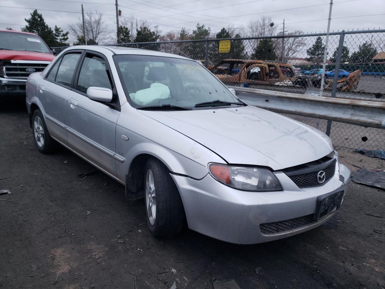 MAZDA PROTEGE 2003 with VIN JM1BJ225531166670 - Photo from auction