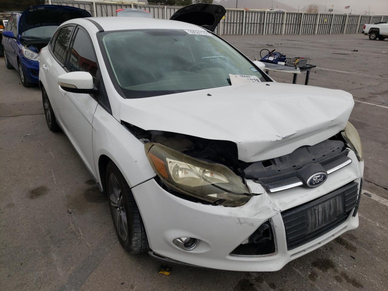 FORD FOCUS SE 2014 with VIN 1FADP3F20EL460410 - Photo from auction