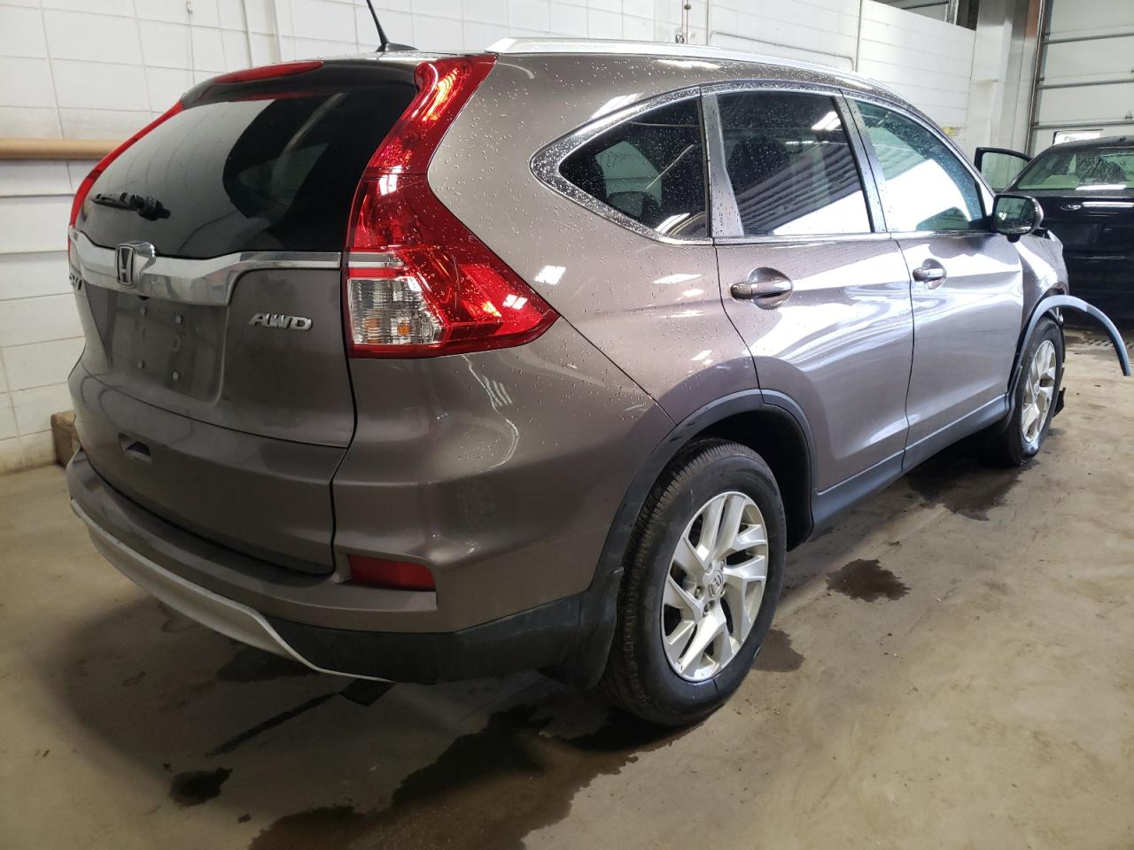 Photo 4 from auction – 2015 HONDA CR-V EXL with VIN 5J6RM4H79FL093476