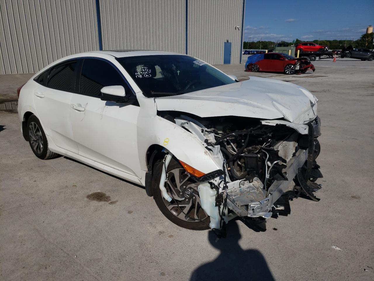 HONDA CIVIC EX 2018 with VIN 19XFC2F79JE014201 - Photo from auction