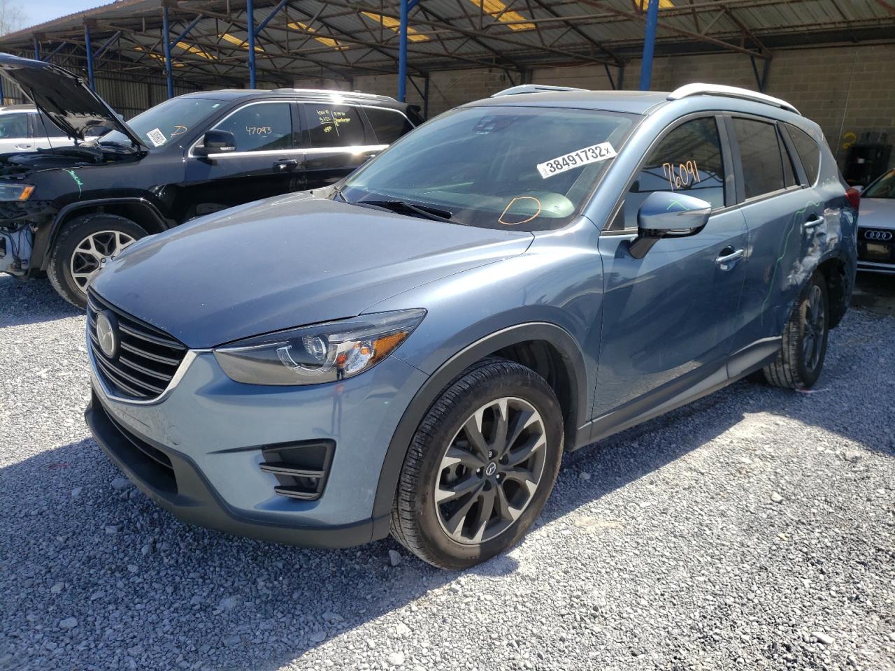 Photo 2 from auction – 2016 MAZDA CX-5 GT with VIN JM3KE2DY2G0605757