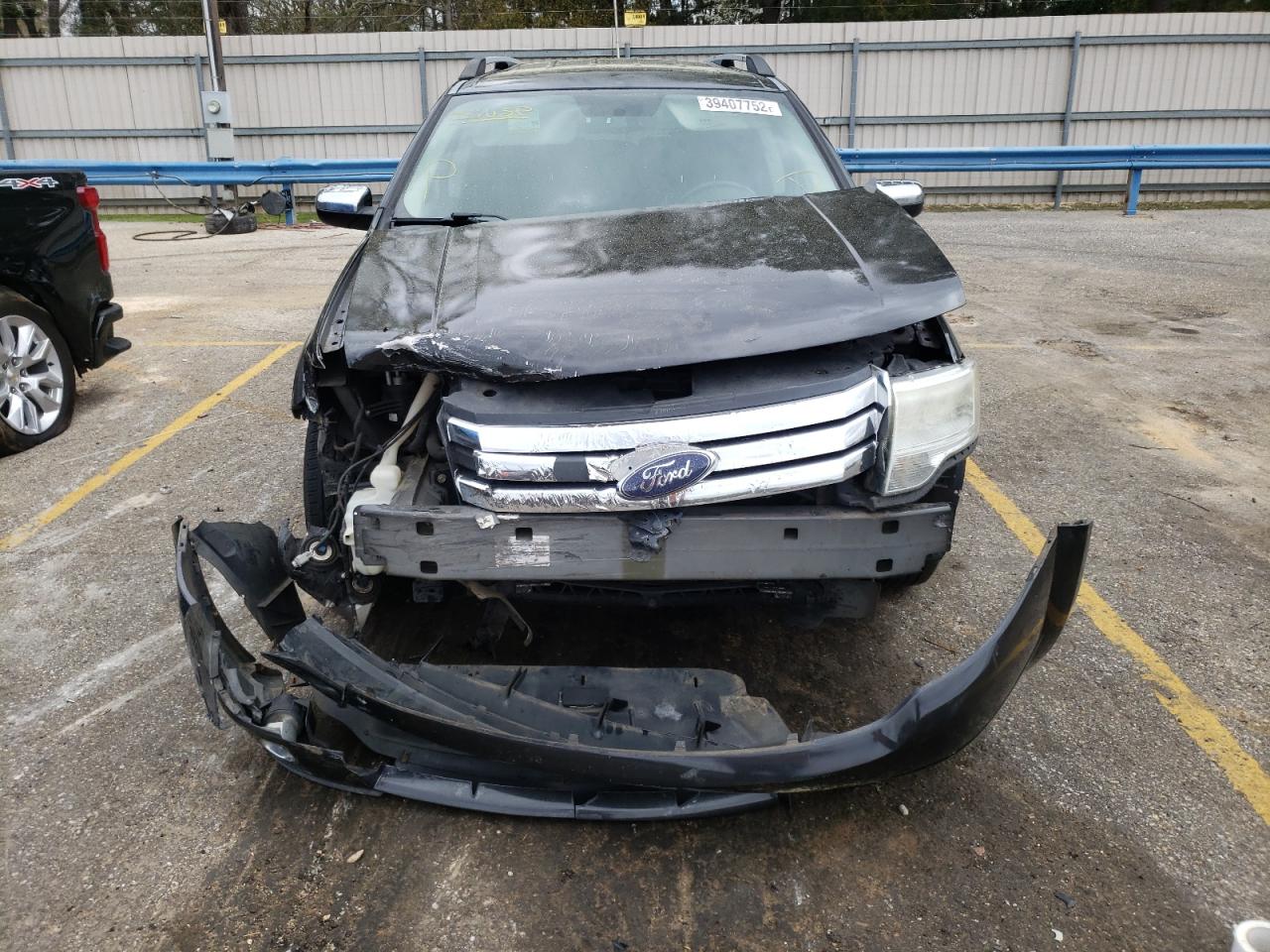 Photo 9 from auction – 2008 FORD TAURUS X L with VIN 1FMDK06W18GA31375