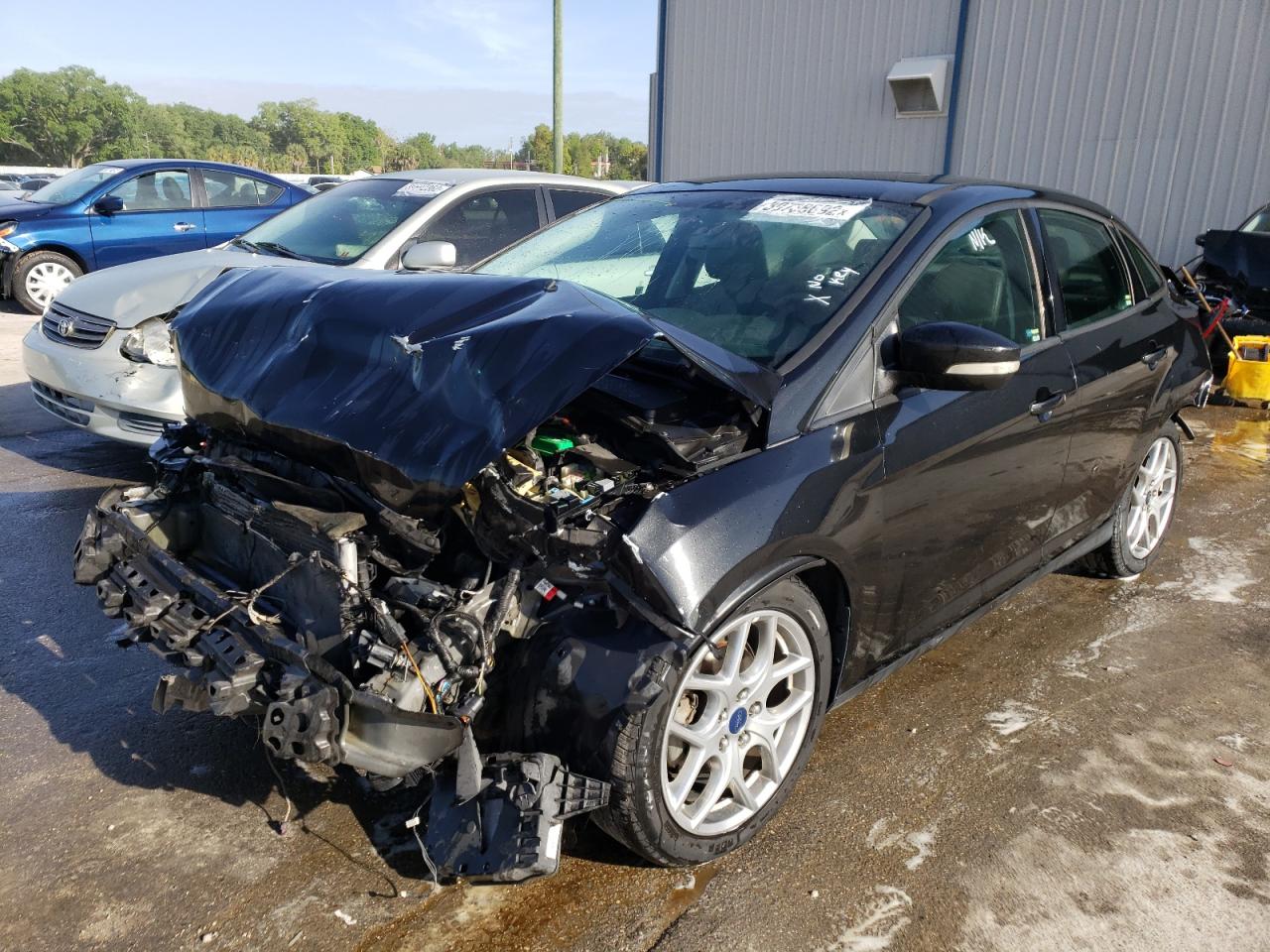 Photo 2 from auction – 2015 FORD FOCUS SE with VIN 1FADP3F21FL284095