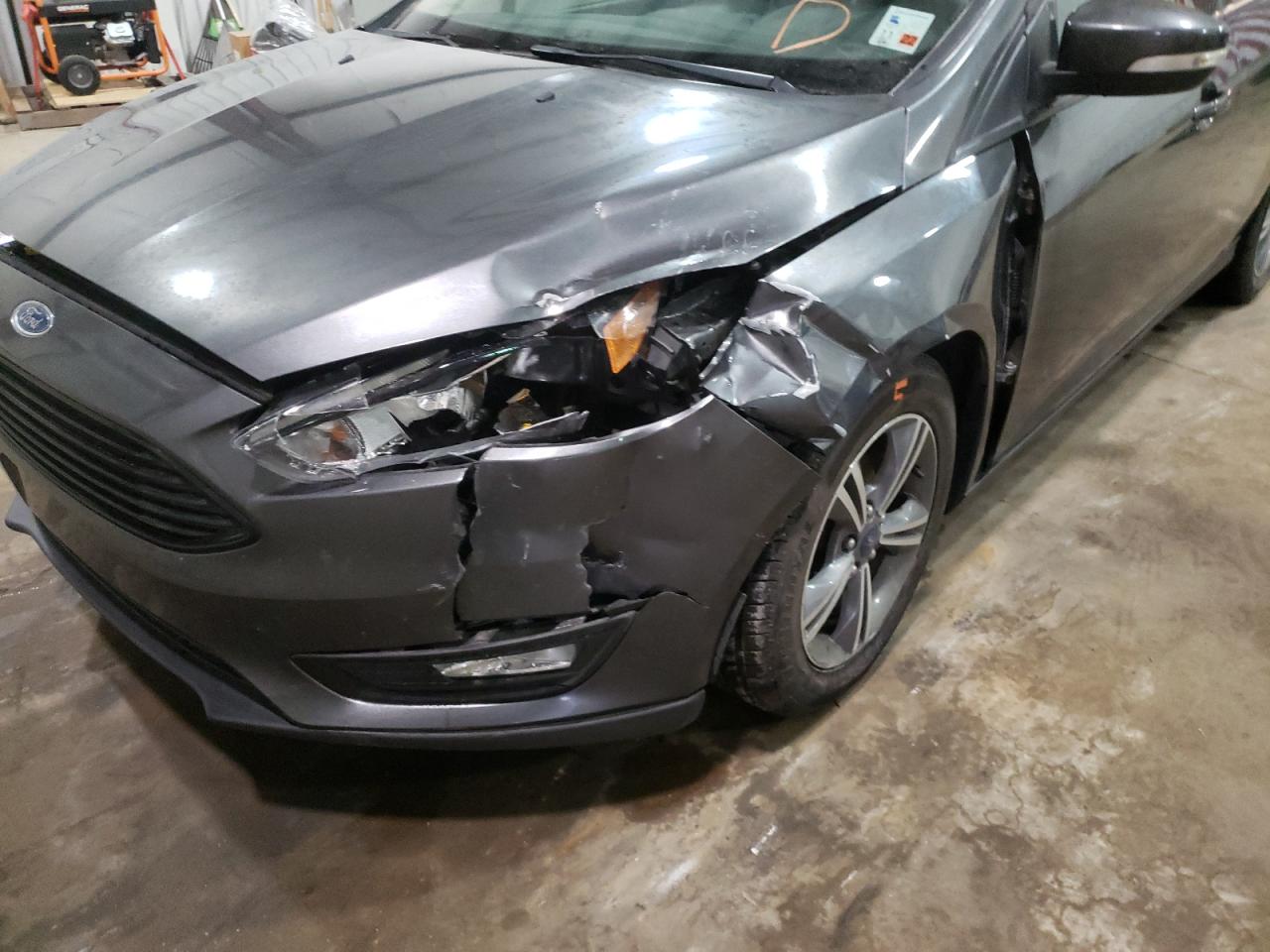 Photo 9 from auction – 2016 FORD FOCUS SE with VIN 1FADP3FE5GL393526