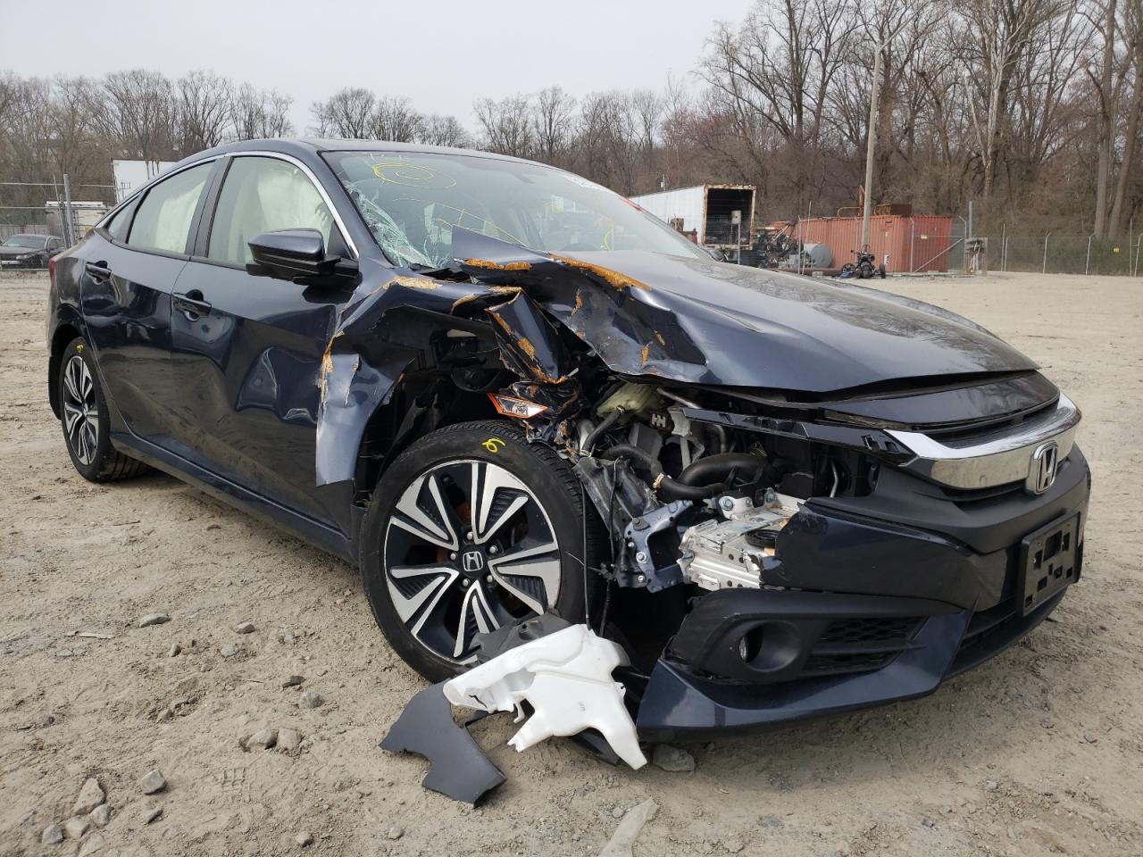 HONDA CIVIC EX 2018 with VIN JHMFC1F33JX033719 - Photo from auction