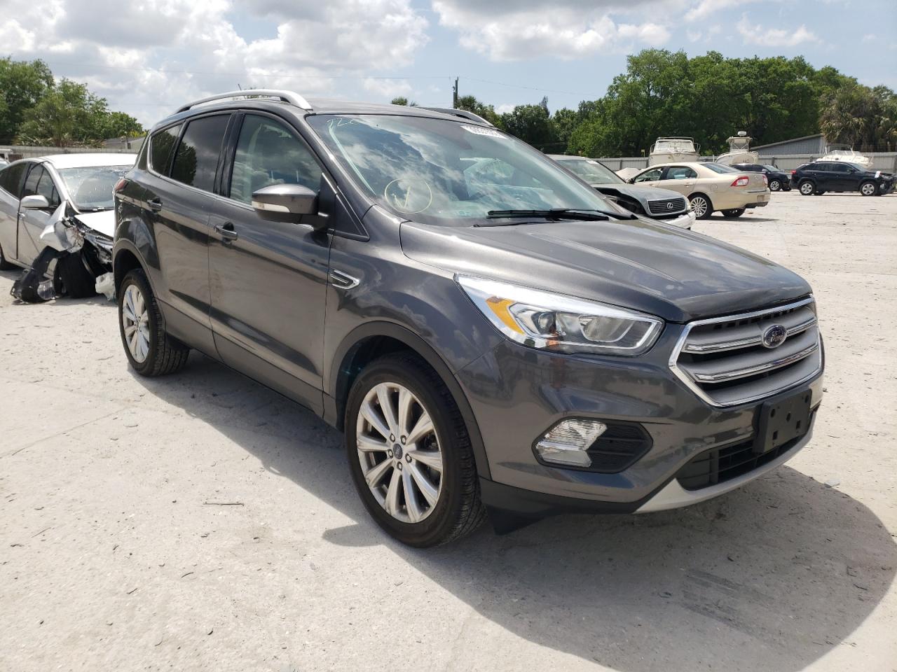FORD ESCAPE TIT 2017 with VIN 1FMCU0J92HUB20042 - Photo from auction