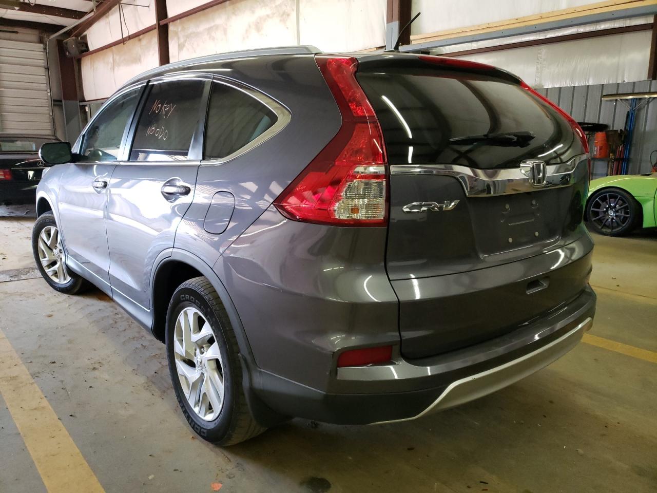 Photo 3 from auction – 2016 HONDA CR-V EXL with VIN 2HKRM3H77GH500152