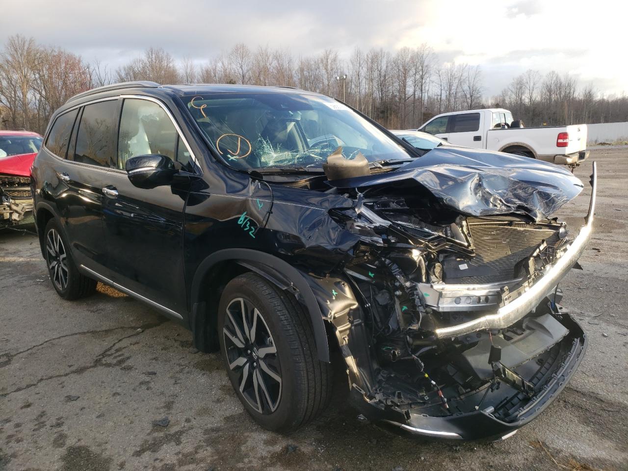 HONDA PILOT TOUR 2020 with VIN 5FNYF6H65LB047365 - Photo from auction