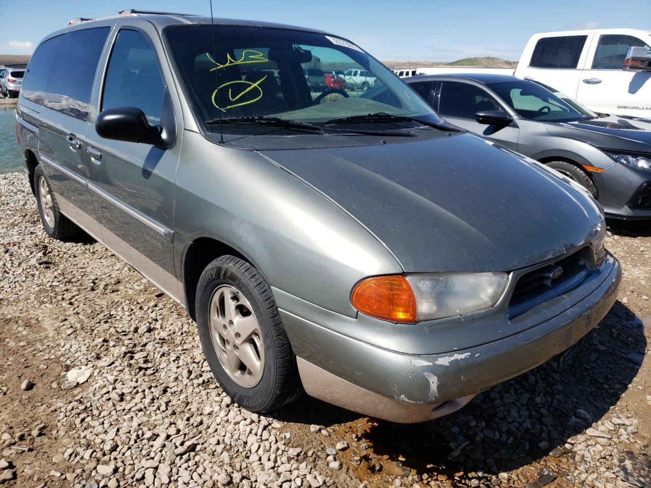 FORD WINDSTAR W 1998 with VIN 2FMZA5140WBD62903 - Photo from auction