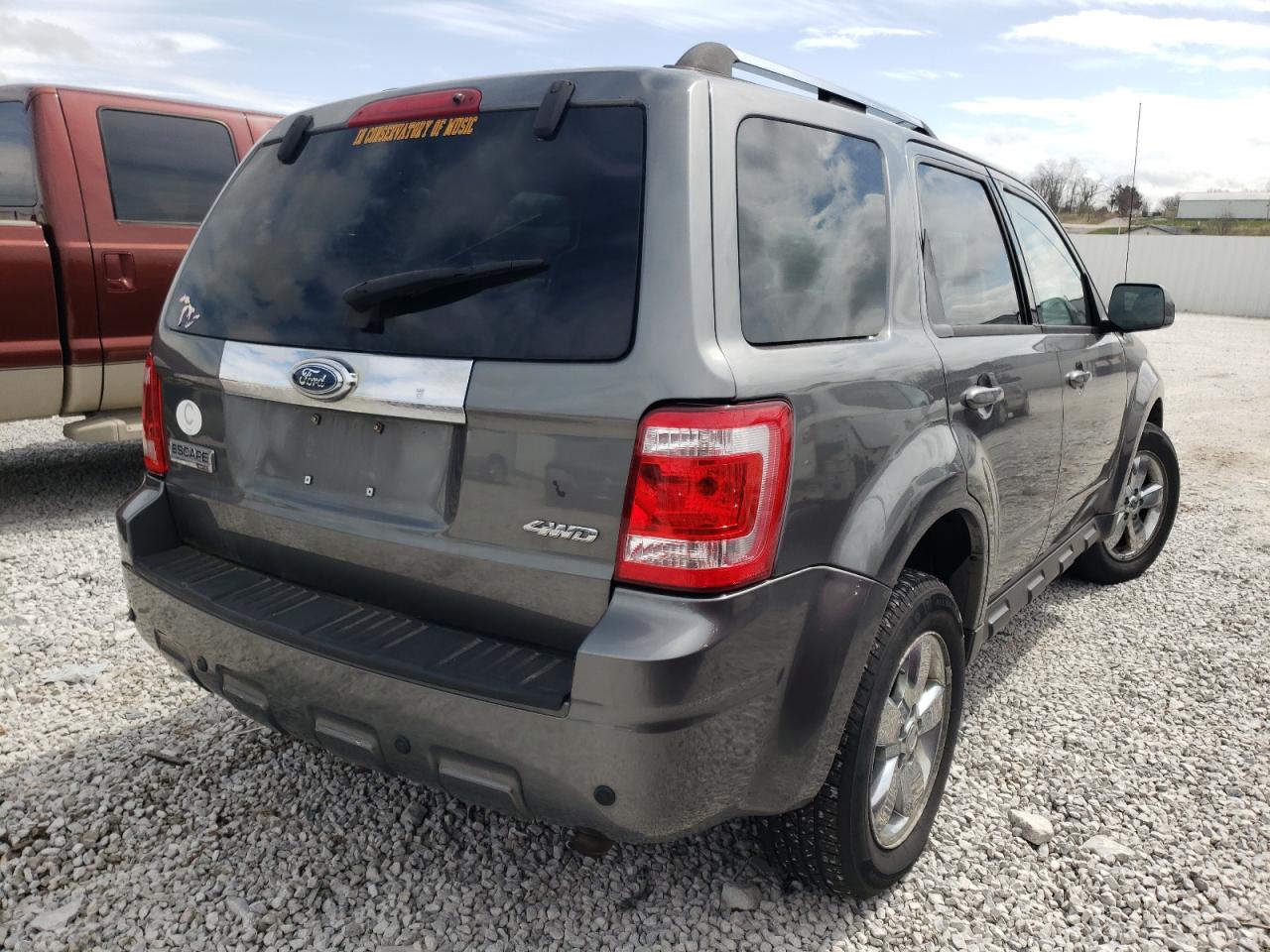 Photo 4 from auction – 2009 FORD ESCAPE LIM with VIN 1FMCU94G09KA02843