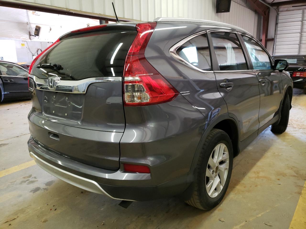 Photo 4 from auction – 2016 HONDA CR-V EXL with VIN 2HKRM3H77GH500152